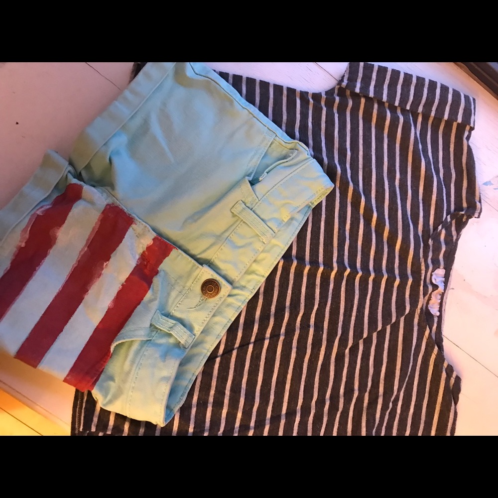 Teal shorts and grey and white shirt